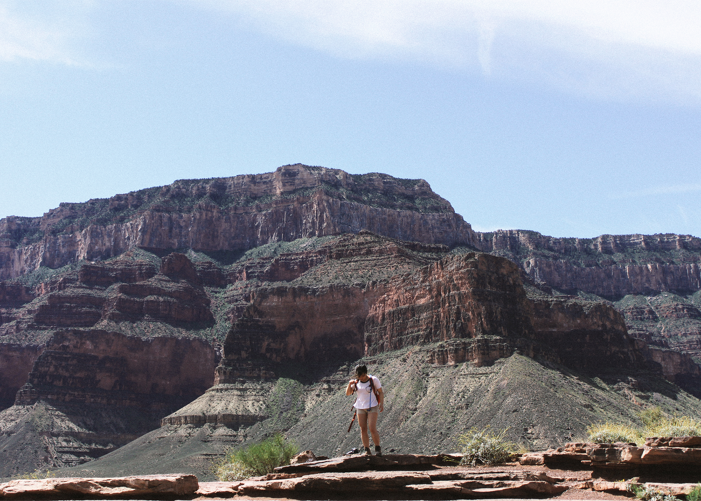 Jennifer standing with the red rocks in the background.