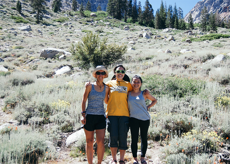 Tamara, Vivian, and Jennifer smiling happily after a great backpacking trip