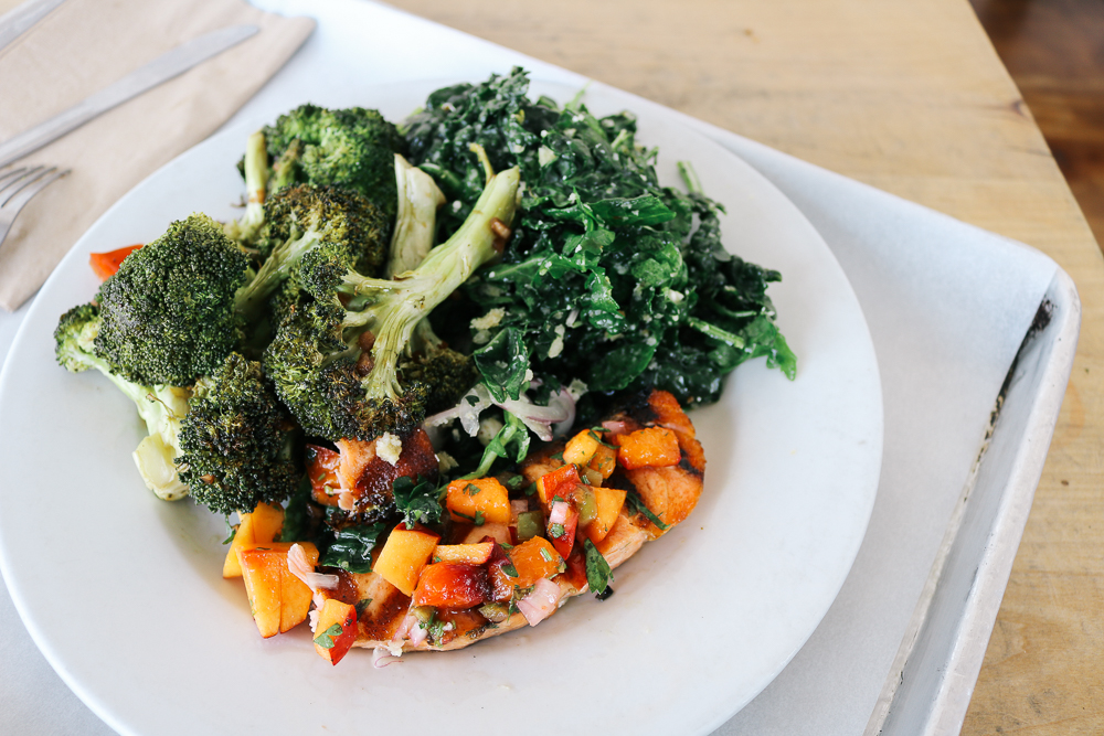 Fresh grilled salmon, kale salad, and roasted broccoli