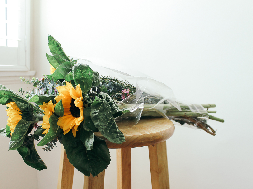 Sunflower bouquet on a wooden chair