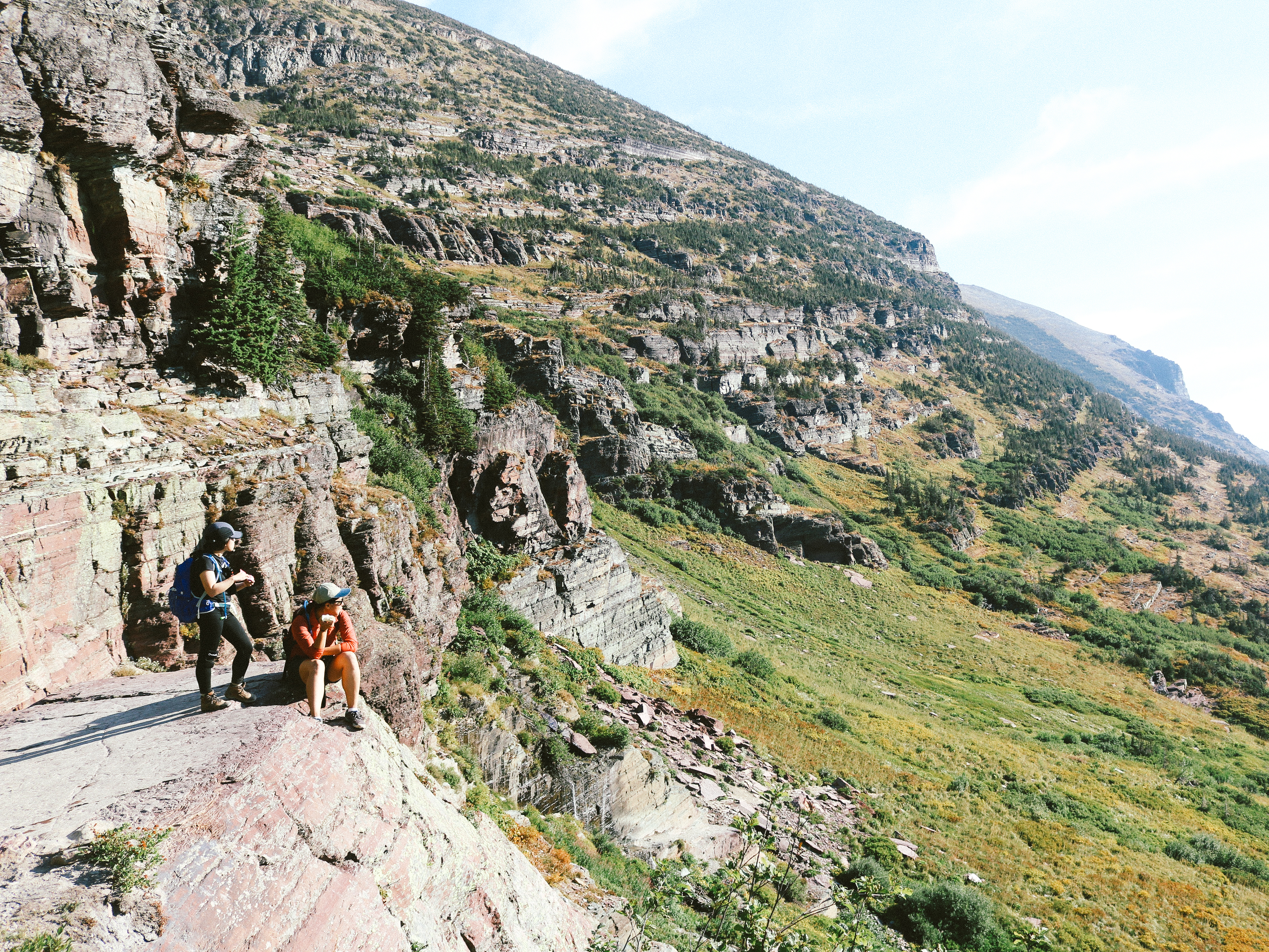 two female hikers stop to take in the view on the Grinnel Glacier Trail
