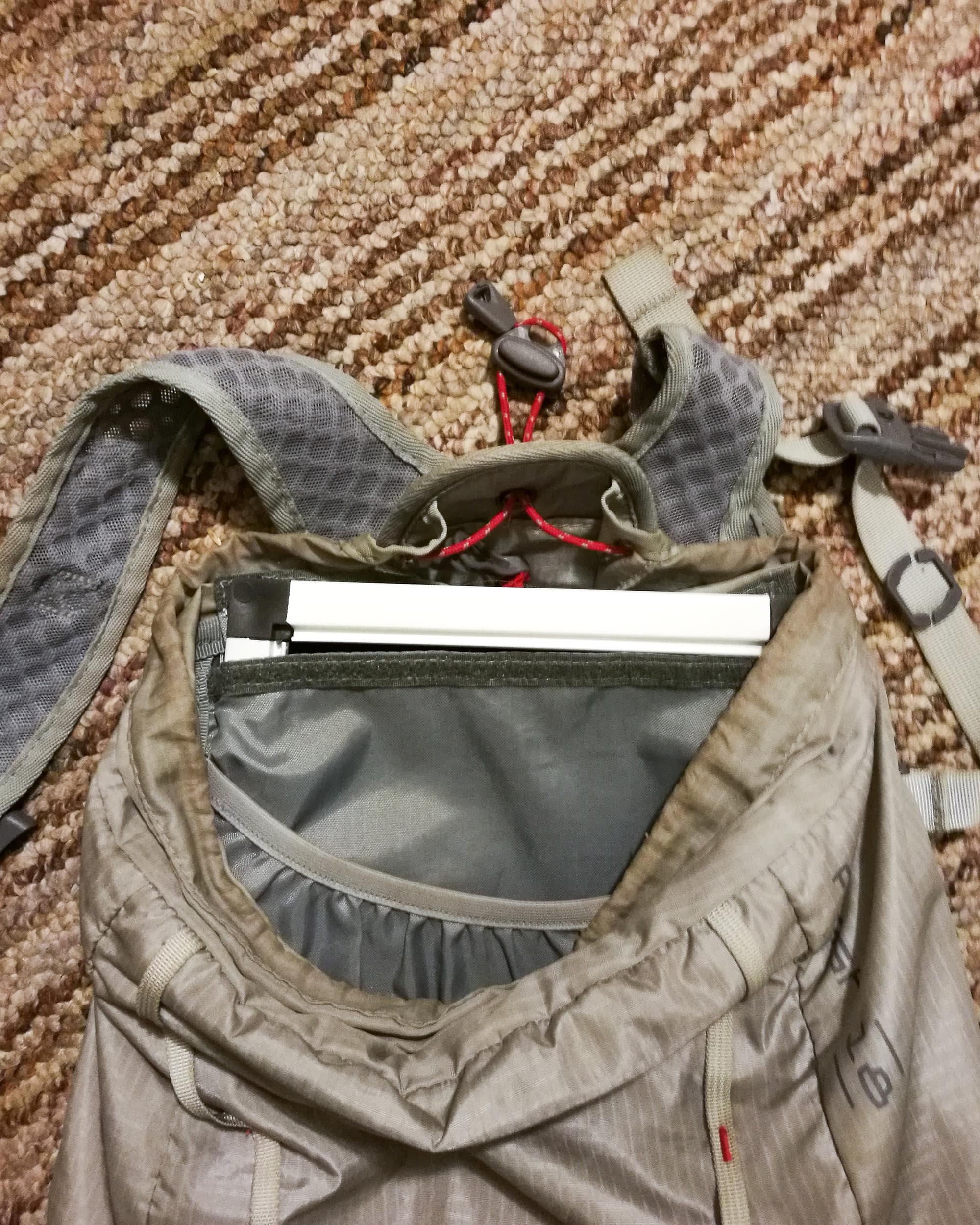 The frame inside the padded pouch of the REI 18L Flash Pack