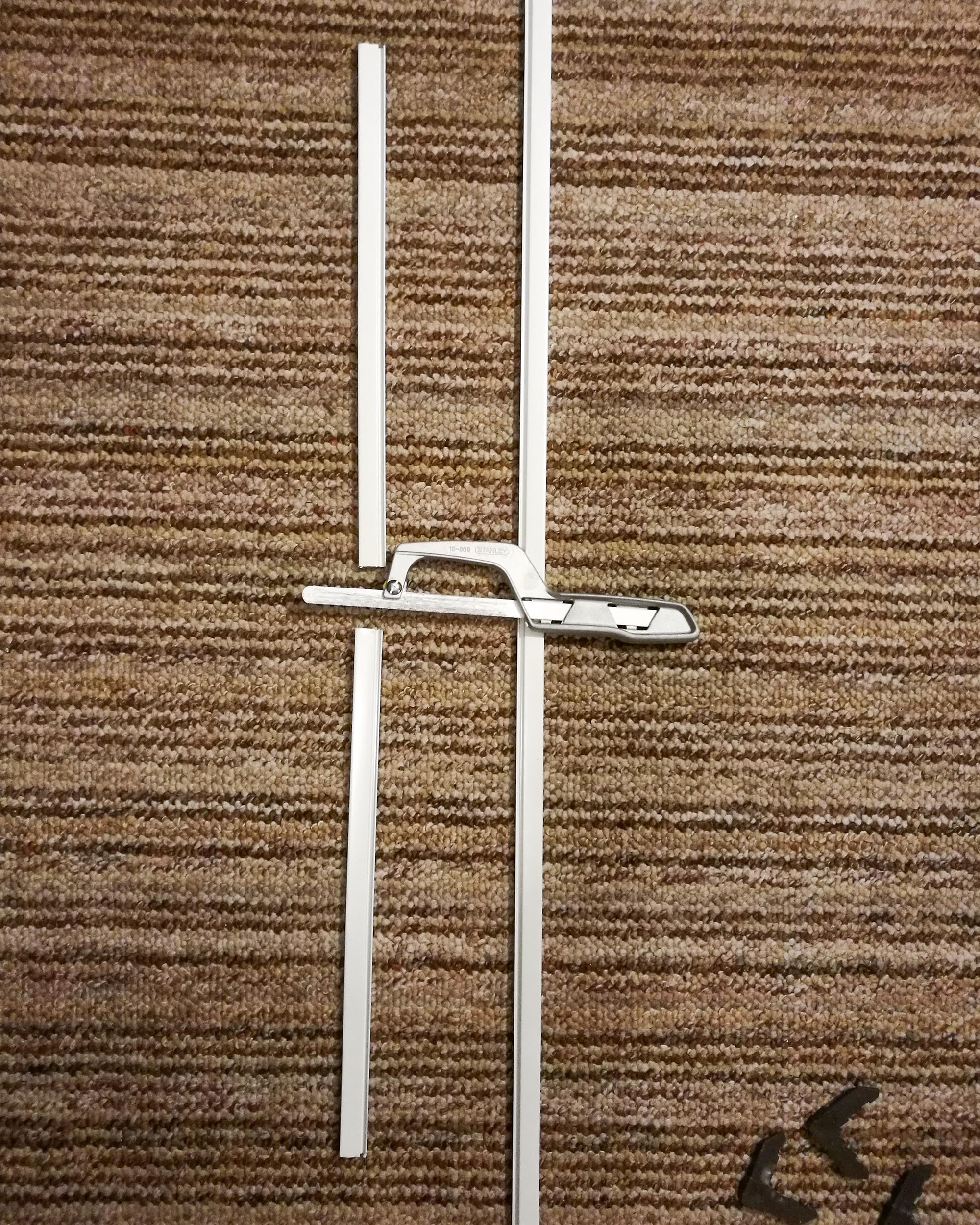 Frame with metal handsaw and connectors