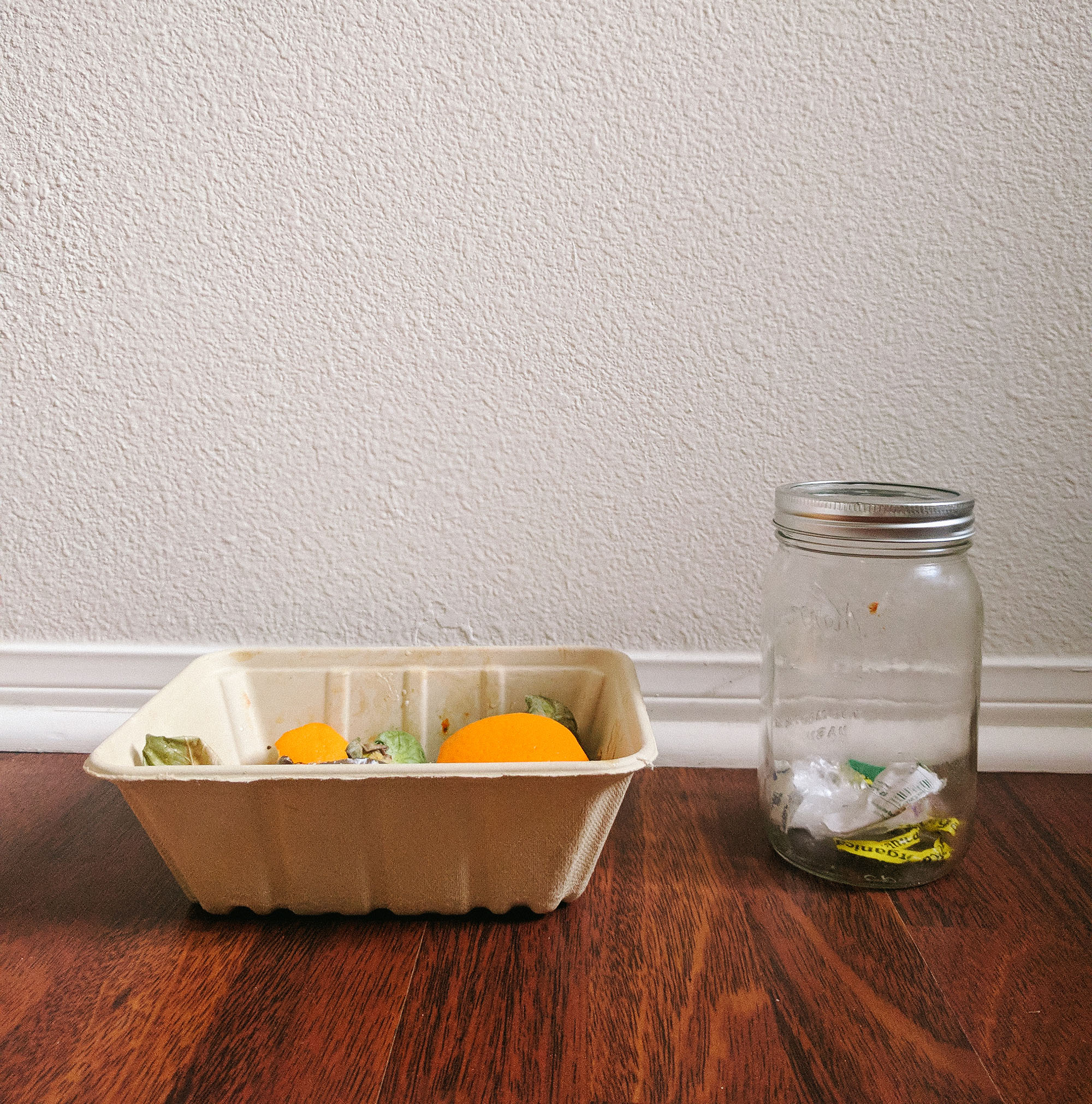 mason jar with waste and compost pile day 1