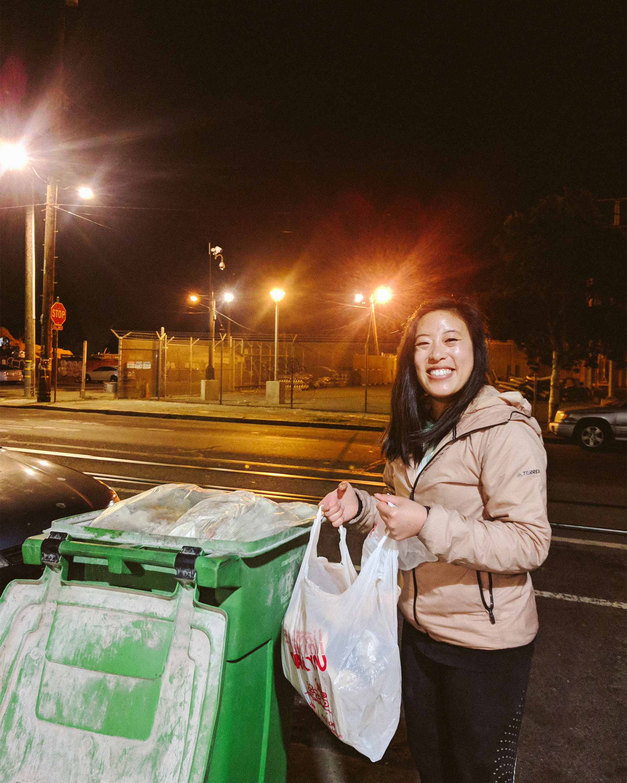 Photo of Vivian with food waste in plastic bag
