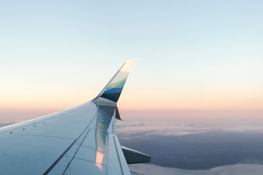 flying above the clouds on an airplane